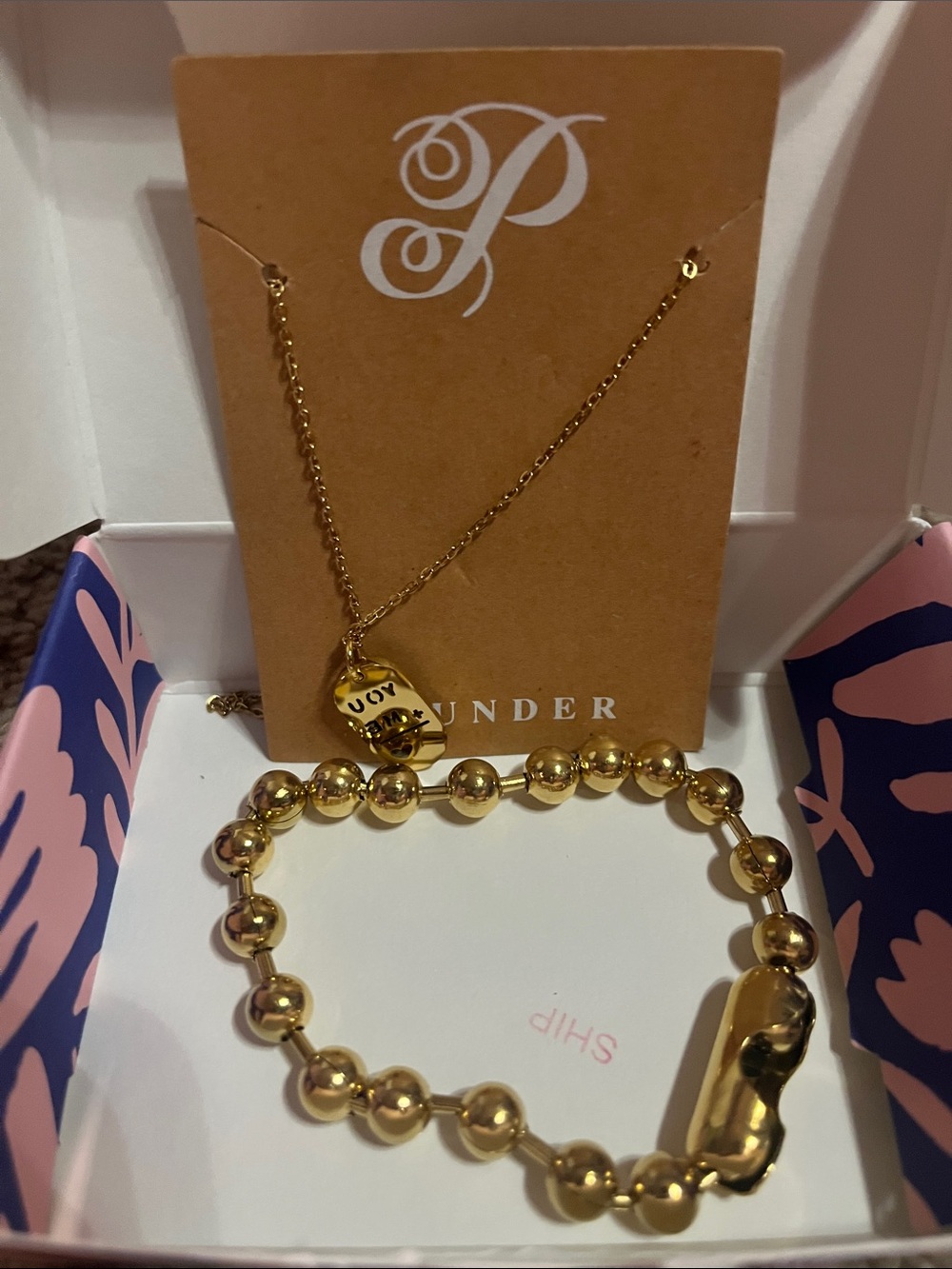 Plunder Gold-Tone necklace that says you and me and a Beaded Bracelet with Charm